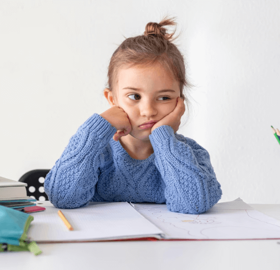 girl at desk doing homework